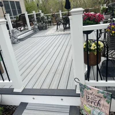 Custom outdoor living space featuring grey Trex composite deck by Legacy Deck Masters